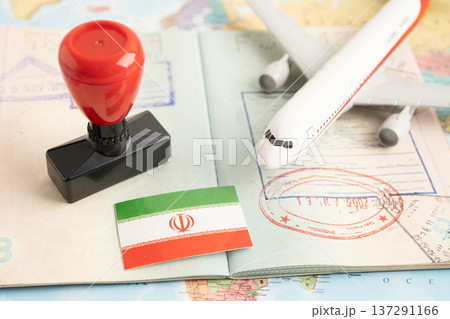 Approved Stamp visa and passport with Iran flag document to immigration at airport in country. Approved Stamp visa and passport with Iran flag document to immigration at airport in country. 137291166