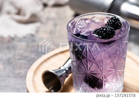 Bramble cocktail with blackberries and crushed Ice. Bramble cocktail with blackberries and crushed Ice. 137291578