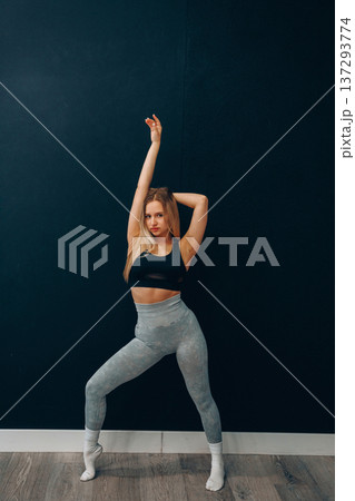 Portrait Of Beautiful Young Female Doing Exercising.Woman Stretching, And Enjoying Fitness Training And Healthy Lifestyle. Yoga For Health Portrait Of Beautiful Young Female Doing Exercising.Woman Stretching, And Enjoying Fitness Training And Healthy Lifestyle. Yoga For Health 137293774