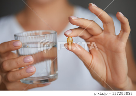 Happy Smiling Woman Taking Pill With Cod Liver Oil Omega-3 And Holding A Glass Of Fresh Water In Morning. Vitamin D, E, A Fish Oil Capsules. Diet. Nutrition. Happy Smiling Woman Taking Pill With Cod Liver Oil Omega-3 And Holding A Glass Of Fresh Water In Morning. Vitamin D, E, A Fish Oil Capsules. Diet. Nutrition. 137293855