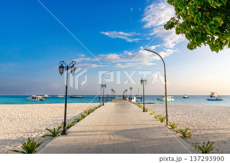 Bright sky above long sandy beach 137293990