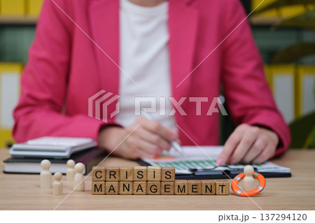 Crisis management strategies in action at a modern office setting with engaging teamwork dynamics Crisis management strategies in action at a modern office setting with engaging teamwork dynamics 137294120