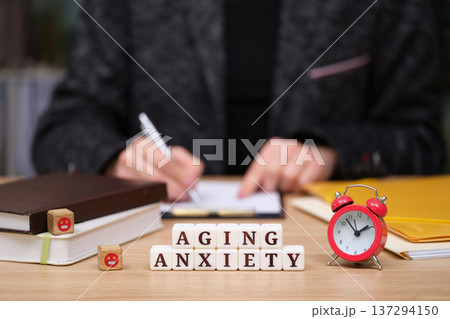 Exploring the emotions of aging anxiety through reflection and planning in a cozy workspace 137294150
