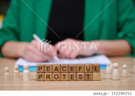 People gather to support a peaceful protest as messages of change and unity fill the air with hope and determination 137294152