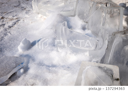 Large Ice Blocks And Broken Ice Pieces Outdoors On Snow Large Ice Blocks And Broken Ice Pieces Outdoors On Snow 137294363