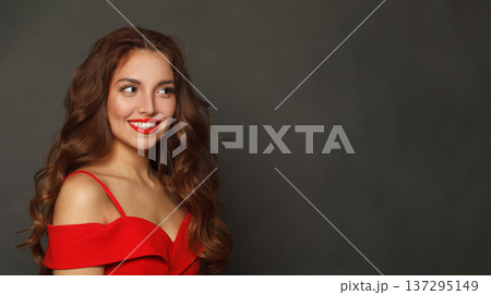 Joyful brunette woman with trendy make-up and brown curly hair wavy hairstyle and red lips makeup Joyful brunette woman with trendy make-up and brown curly hair wavy hairstyle and red lips makeup 137295149