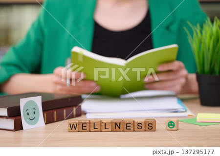 Explore wellness through reading and mindfulness in a serene workspace for personal growth and positivity Explore wellness through reading and mindfulness in a serene workspace for personal growth and positivity 137295177