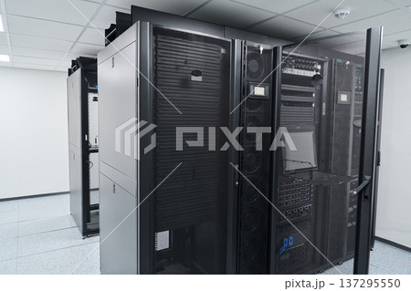 Modern data center server racks and network equipment in a secure, climate-controlled server room Modern data center server racks and network equipment in a secure, climate-controlled server room 137295550