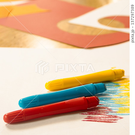 Colorful crayons creating art on paper for childhood creativity 137297389