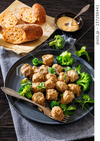 Belgian meatballs in creamy gravy with broccoli and bread Belgian meatballs in creamy gravy with broccoli and bread 137298441