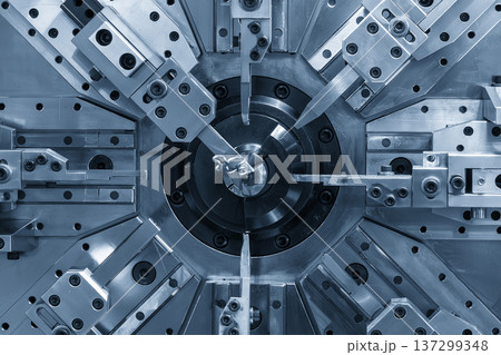 Automated hydraulic bending machine performing high-precision wire coiling for heavy-duty spring manufacturing. Automated hydraulic bending machine performing high-precision wire coiling for heavy-duty spring manufacturing. 137299348