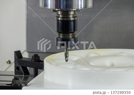 High-precision CNC milling of engineering nylon (polyamide) using a solid carbide ball nose end mill for complex 3D contouring. High-precision CNC milling of engineering nylon (polyamide) using a solid carbide ball nose end mill for complex 3D contouring. 137299350