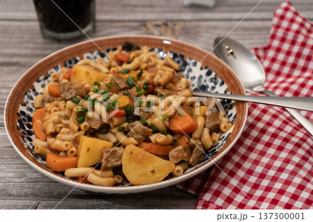 Hearty beef goulash stew with macaroni pasta and vegetables 137300001
