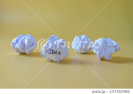 Text IDEA on Crumple the paper ball on color background. Text IDEA on Crumple the paper ball on color background. 137302460
