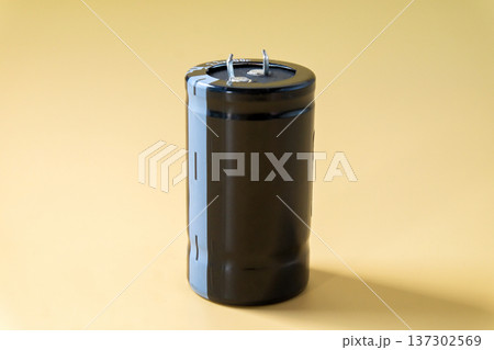 Capacitor, DIY Electronic Parts on color background. Capacitor, DIY Electronic Parts on color background. 137302569