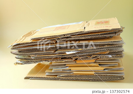 Stack of cardboard pieces on color background. 137302574