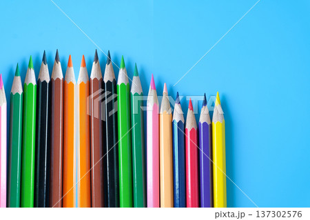 Group of colored pencils on color background. Group of colored pencils on color background. 137302576