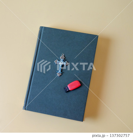 Bible book with Thumb drive on color background. Bible book with Thumb drive on color background. 137302757