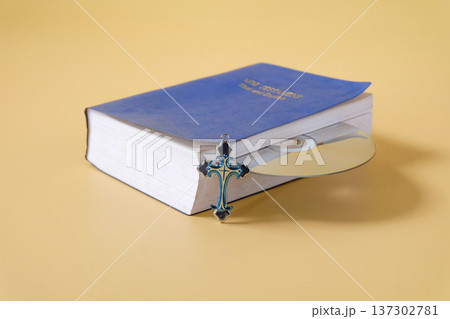 Bible book with CD rom on color background. 137302781