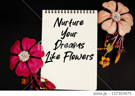 Nurture Your Dreams Like Flowers Motivational and Inspirational quote written on notepad 137303075