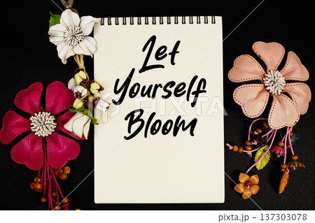 Let Yourself Bloom Motivational and Inspirational quote written on notepad 137303078