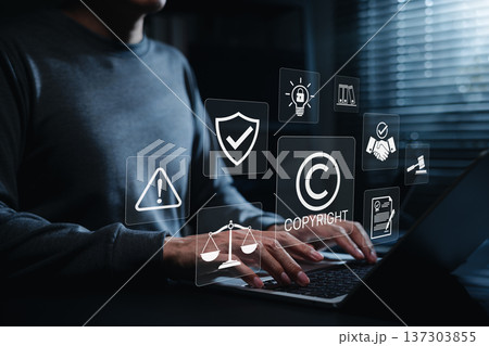 Copyright protection concept. Person using laptop with copyright, legal, security, and compliance icons, representing intellectual property rights, digital content protection and online law management Copyright protection concept. Person using laptop with copyright, legal, security, and compliance icons, representing intellectual property rights, digital content protection and online law management 137303855