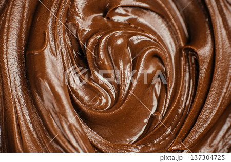 Glossy chocolate spread texture swirl background Glossy chocolate spread texture swirl background 137304725