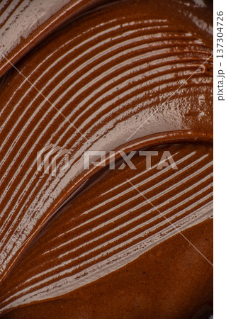 Chocolate Cream Texture with Spoon Lines Macro Background Chocolate Cream Texture with Spoon Lines Macro Background 137304726