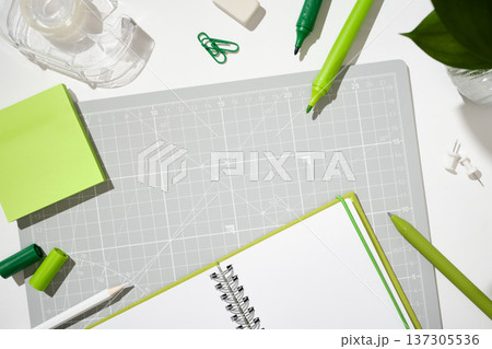 Creative workspace with markers, tape, and sticky notes for planning and projects. 137305536
