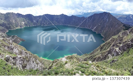 a large volcanic crater lake surrounded by steep, rugged cliffs, with a deep blue-green color of water a large volcanic crater lake surrounded by steep, rugged cliffs, with a deep blue-green color of water 137307439