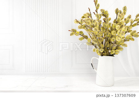 Delicate willow branches in vase on kitchen table. Palm Sunday concept, preparation for Easter celebrations, design template with space for text and a festive Easter banner, home interior design, Delicate willow branches in vase on kitchen table. Palm Sunday concept, preparation for Easter celebrations, design template with space for text and a festive Easter banner, home interior design, 137307609
