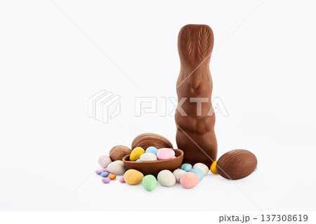 Chocolate easter bunny with decorated candy eggs Chocolate easter bunny with decorated candy eggs 137308619
