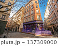 Lyon, france. December 27, 2023. Vieux lyon street with historic buildings and distinctive purple storefront, showing typical european architecture under a clear blue sky 137309000