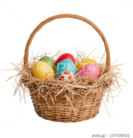 Colorful Eggs in a Woven Basket With Straw on a Plain Background for Easter Celebration 137309581