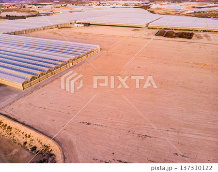 Aerial view. Commercial greenhouses on coast, Spain. Aerial view. Commercial greenhouses on coast, Spain. 137310122