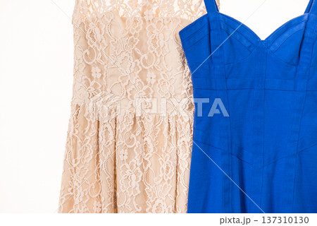 Colorful dresses hanging on clothes hanger Colorful dresses hanging on clothes hanger 137310130