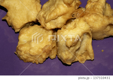 A Deep fried and golden battered soya tofu pieces golden fresly cooked A Deep fried and golden battered soya tofu pieces golden fresly cooked 137310431