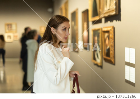 Girl view pictures and icons in museum hall Girl view pictures and icons in museum hall 137311266
