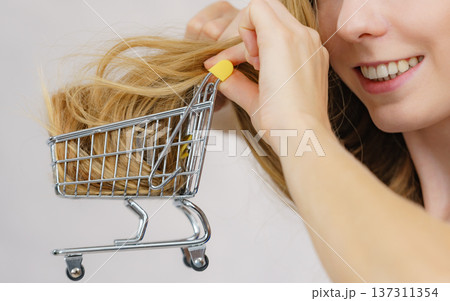 Girl with her long hair in shopping cart 137311354