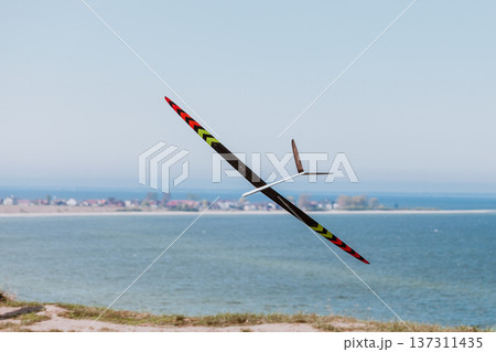 RC soaring plane on blue sky 137311435