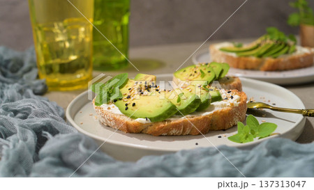 Toast with avocado cream cheese and wheat bread Toast with avocado cream cheese and wheat bread 137313047