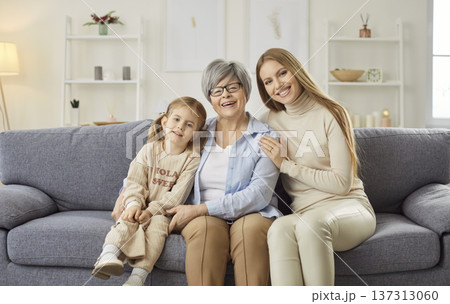 Kind loving three generations, affectionate young granddaughter and elderly grandma close hug 137313060