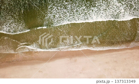 Ocean waves crashing on beach Ocean waves crashing on beach 137313349