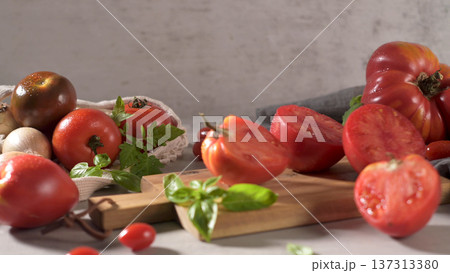 Tomatoes on rustic kitchen counter Tomatoes on rustic kitchen counter 137313380