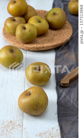 Rustic Arrangement of Golden Apples and Cinnamon 137313668