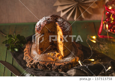Sliced Panettone Cake with Sugar Dusting on Rustic Wood Sliced Panettone Cake with Sugar Dusting on Rustic Wood 137313758