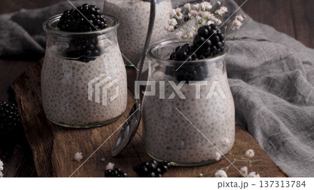 Chia Seed Pudding with Fresh Blackberries in Glass Jars Chia Seed Pudding with Fresh Blackberries in Glass Jars 137313784