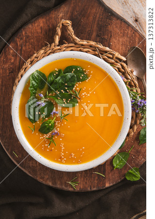 Creamy Butternut Squash Soup Topped with Fresh Spinach and Sesame Seeds Creamy Butternut Squash Soup Topped with Fresh Spinach and Sesame Seeds 137313822