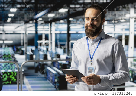 Data center admin doing infrastructure AI deep learning automatization, working on elevated industrial platform. Data scientist maintaining server rigs using artificial intelligence. Data center admin doing infrastructure AI deep learning automatization, working on elevated industrial platform. Data scientist maintaining server rigs using artificial intelligence. 137315246