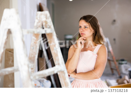 Portrait of thoughful young woman in construction site Portrait of thoughful young woman in construction site 137318218